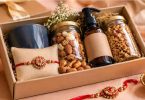 Thoughtful Rakhi gift hamper with healthy snacks, wellness items, and festive rakhi.