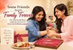 Two best friends celebrate Raksha Bandhan by tying rakhi with joyful smiles together